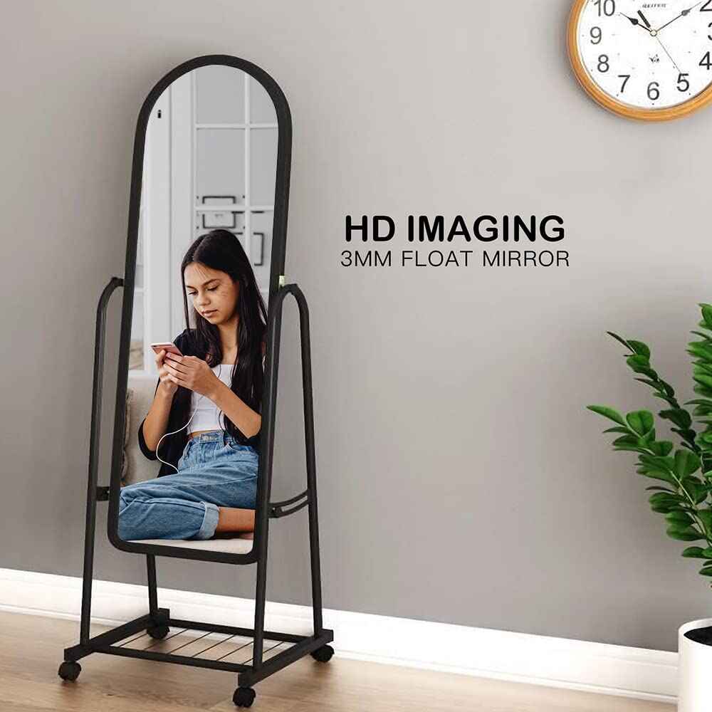 Huitich full length mirror with wheels showing a woman reflected sitting on floor in casual clothes