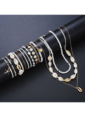 Huitich 14 piece layered beach jewelry set featuring shells, beads, and gold-tone accents