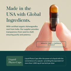 Gaia Herbs Ashwagandha 120 count capsule held between fingers with Liquid Phyto Caps and Made in the USA text