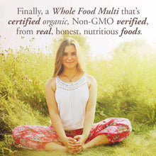 Lifestyle photo of a woman sitting outdoors with multivitamin text above