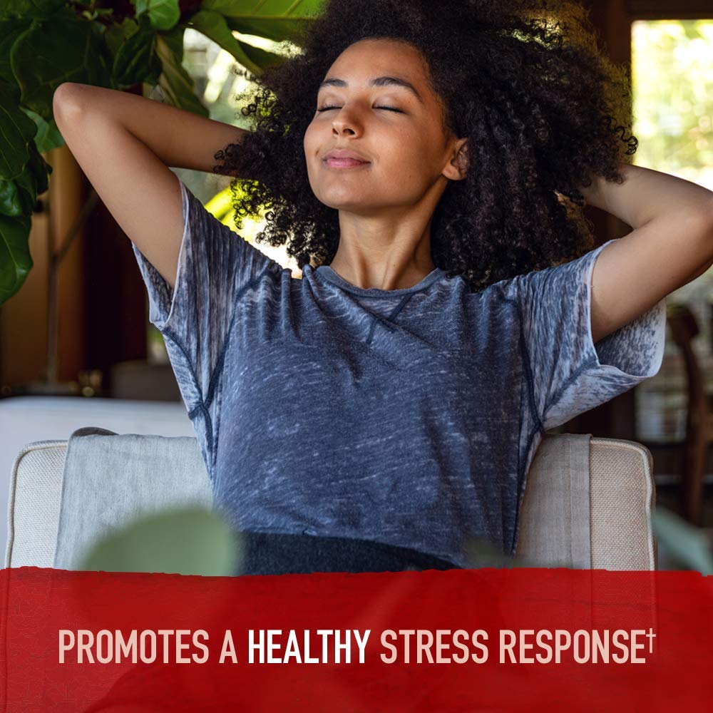 Garden of Life relaxed woman reclining on couch promoting stress relief with organic ashwagandha supplement UAE