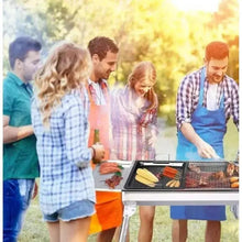 Outdoor charcoal grill with open top and grilling food on the cooking surface