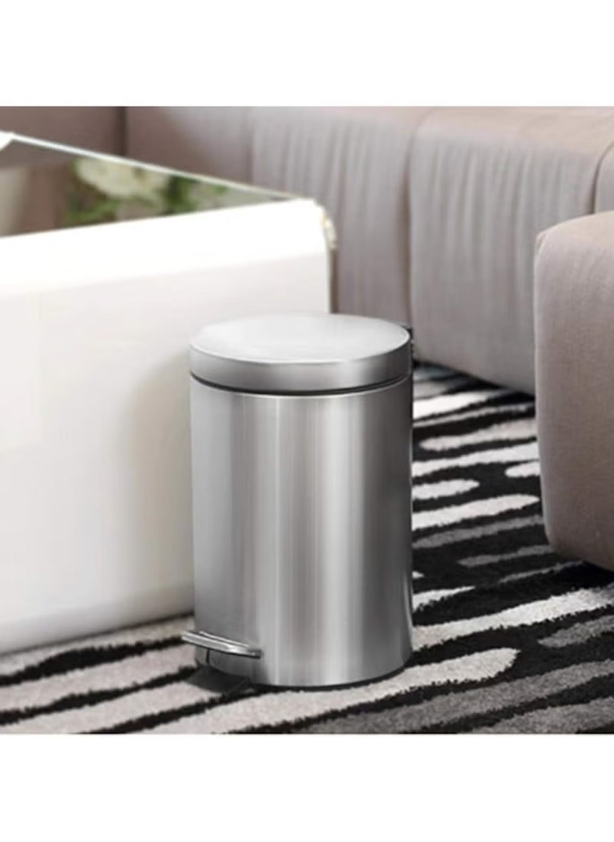 Huitich 12L stainless steel pedal bin placed on a black and white carpet in a modern living room