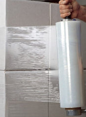 Huitich 3kg packing wrap roll being used to securely wrap stacked cardboard boxes