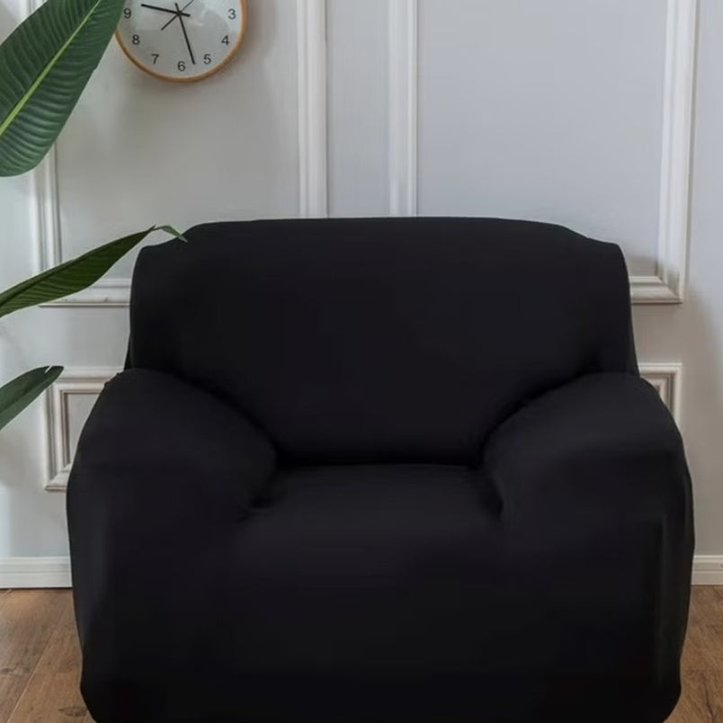 Huitich black elastic sofa cover on a single seat sofa in a modern living room setting