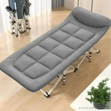 Gray folding camping cot with quilted padded mattress and tubular folding legs