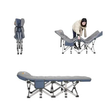 Gray folding camping cot with padded backrest and sturdy folding frame