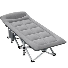 Gray folding camping cot with padded, quilted mattress and cushioned headrest