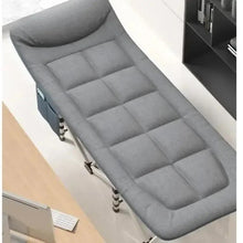 Gray folding camping cot with quilted cushioning and side support panels