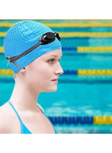 Blue silicone swim cap with textured surface, side profile