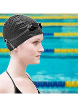 Black silicone swimming cap on model, textured surface with side ventilation