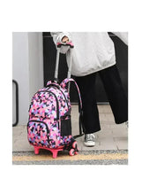 Geometric rolling backpack with pink wheels and front zipper pocket near carry handle