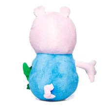 Pink plush pig doll back view in blue outfit, with green dinosaur detail on side.