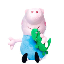 Pink plush pig doll with blue body, red cheeks, green dinosaur perched on arm.