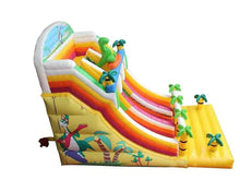 Inflatable jungle water slide with curved rainbow chutes and dinosaur figure artwork