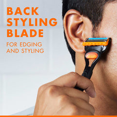 Man using Gillette Fusion 5 men's razor back styling blade to edge and style sideburns and jawline