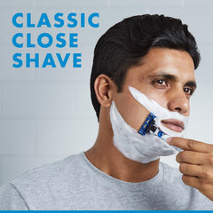 Gillette Mach3 Turbo men's razor used by man for a classic close shave with shaving cream