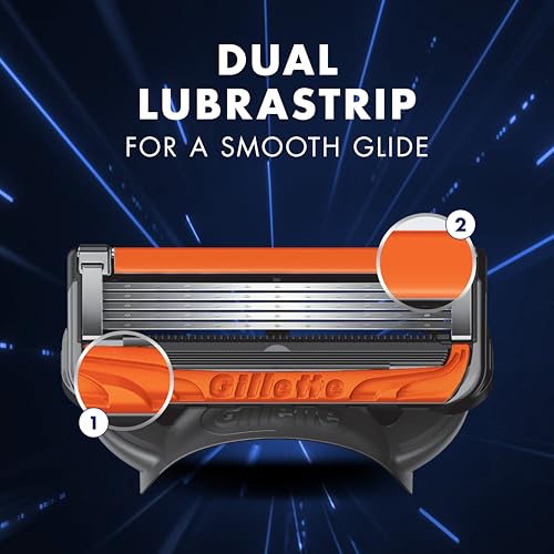 Close up of Gillette ProGlide5 Power Blades razor cartridge showing dual orange lubrastrips for smooth glide