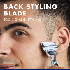 Man edging hair near ear with back styling blade close up shave using Gillette Skinguard Sensitive blade refills