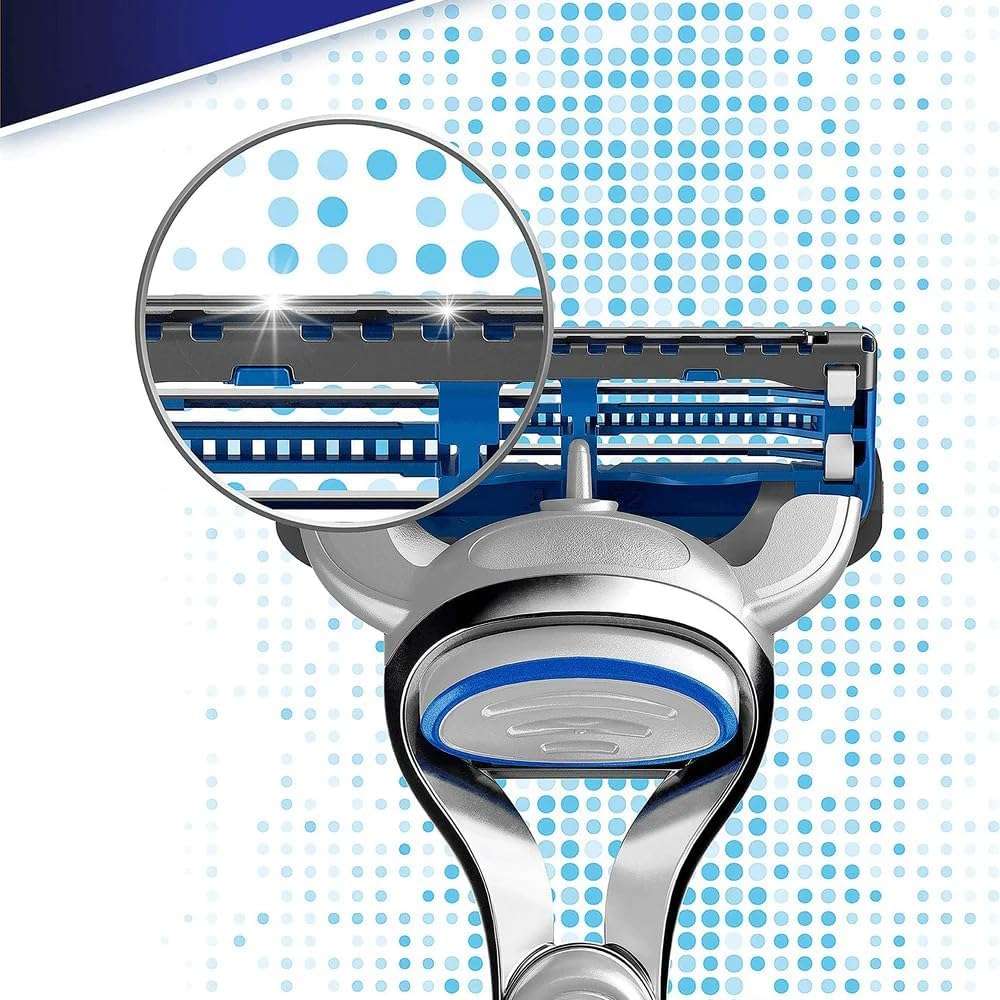 Close up of Gillette SkinGuard Sensitive razor blades head with magnified blades blue strip and silver handle