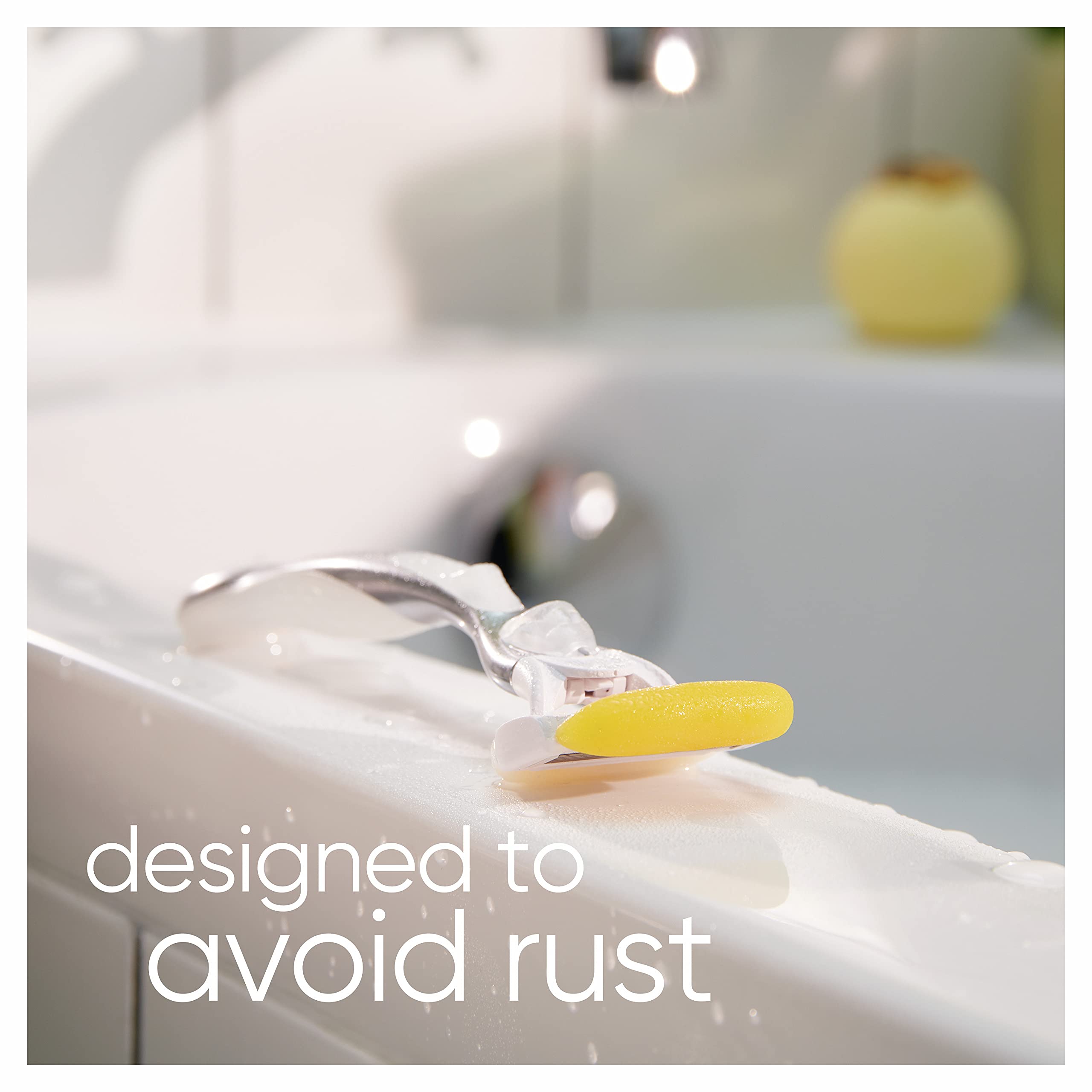 Gillette Venus and Olay razor refills showing a razor resting on a wet bathtub edge with yellow strip