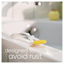 Razor blades gliding on skin with yellow lubricating strip for smooth shaving