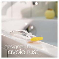 Gillette Venus and Olay razor refills showing a razor resting on a wet bathtub edge with yellow strip