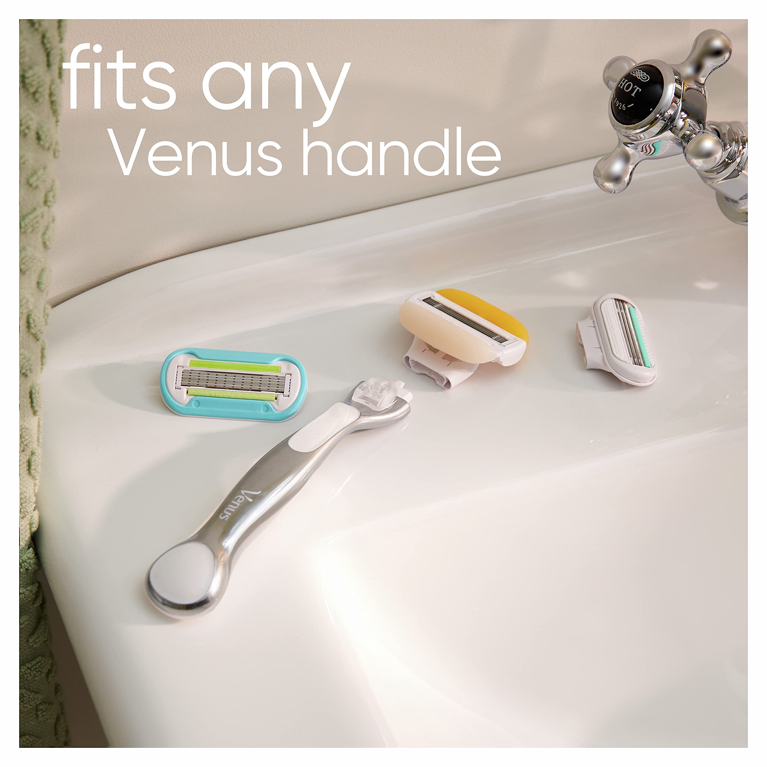 Gillette Venus and Olay razor refills displayed with silver Venus handle and three replacement cartridges on tub