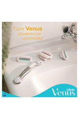 Gillette Venus Comfortglide razor for women displayed on bathroom sink with handle and three replacement razor heads