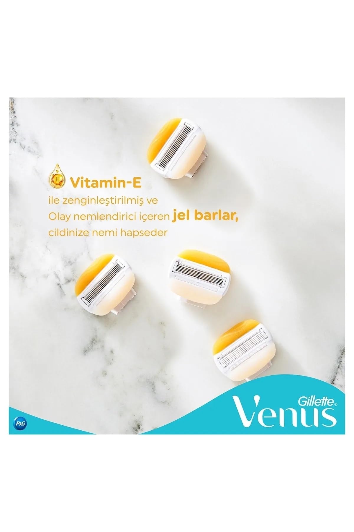 Four Gillette Venus Comfortglide razor for women replacement heads with yellow Vitamin E gel bars on marble background
