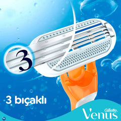 Close up of Gillette Venus disposable razor for women showing three blades orange handle and water droplets