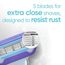 Razor blade refill cartridge close-up showing multiple thin blades in purple housing