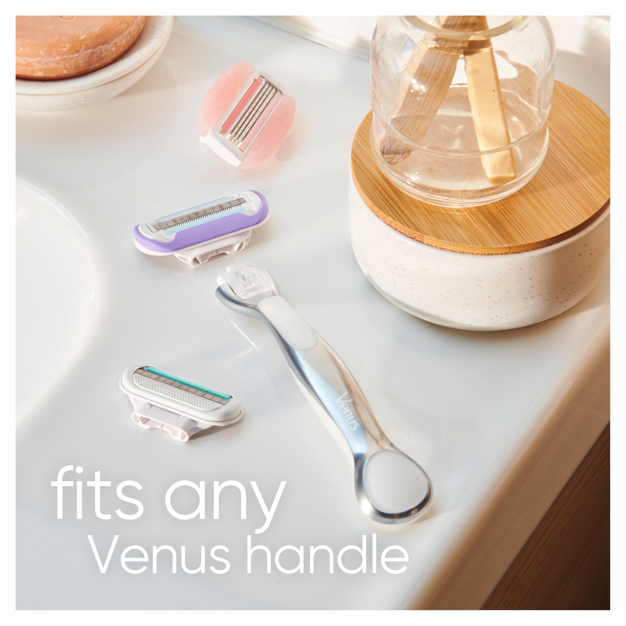 Gillette Venus Swirl blade refills UAE pack showing razor handle and three colorful replacement blades on bathroom counter