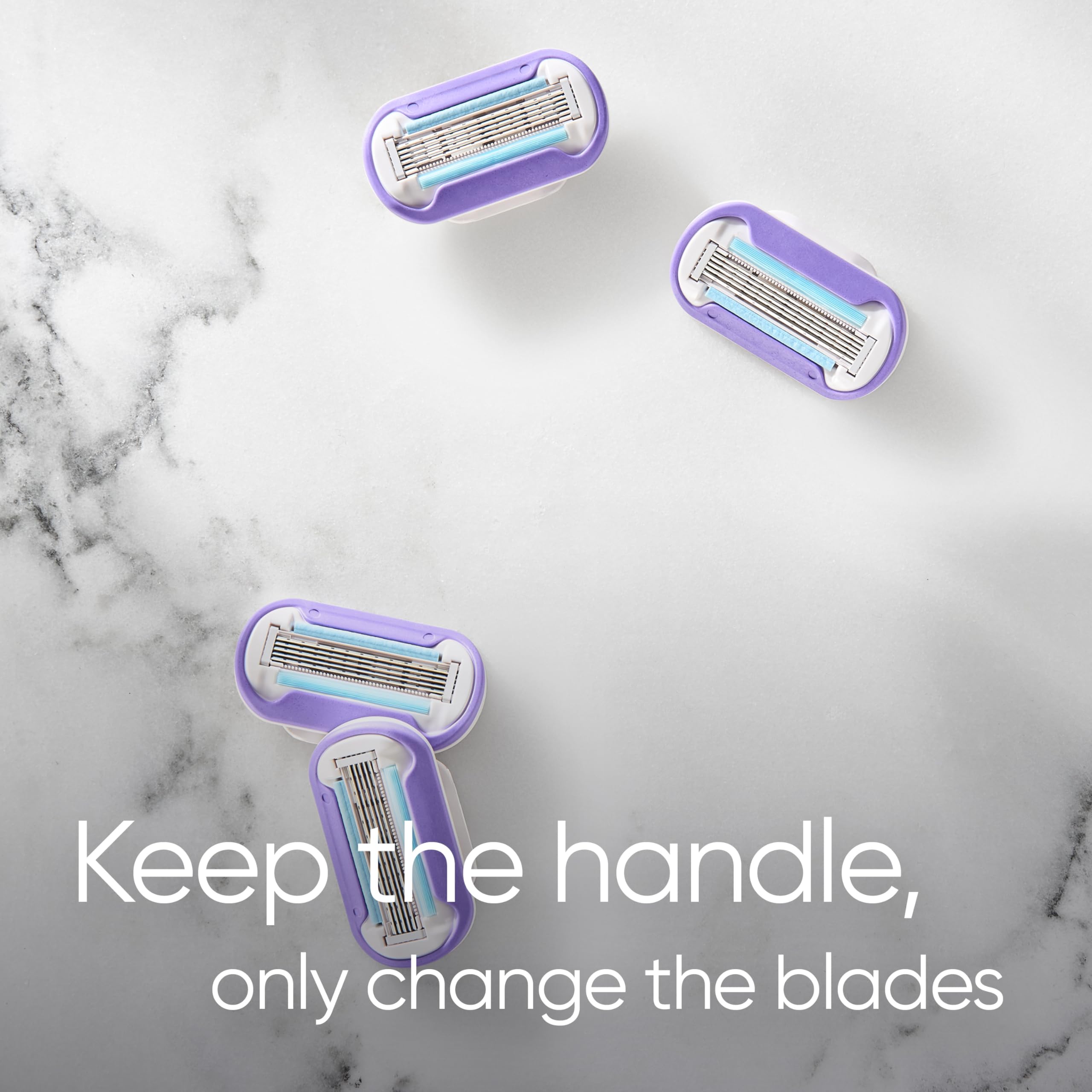 Gillette Venus Swirl blade refills UAE four purple razor cartridges on marble background with keep the handle text