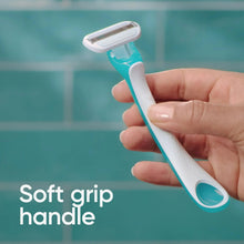 Handheld disposable razor with soft-grip handle, teal accents and white head