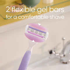 Close up Venus razor with two flexible gel bars on purple handle near sink Venus razor blade refills for women