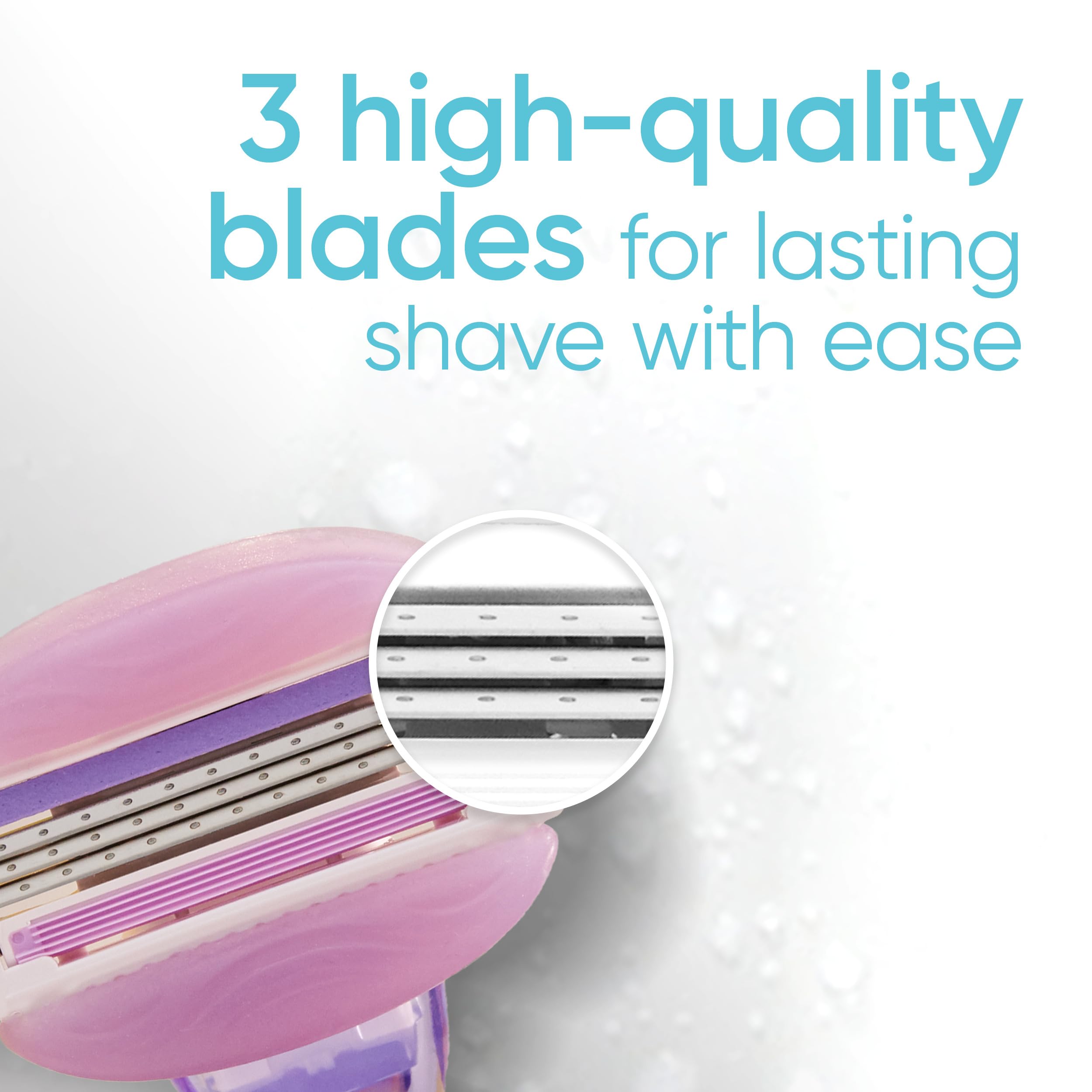 Close up pink razor head showing three blades and water droplets Venus razor blade refills for women