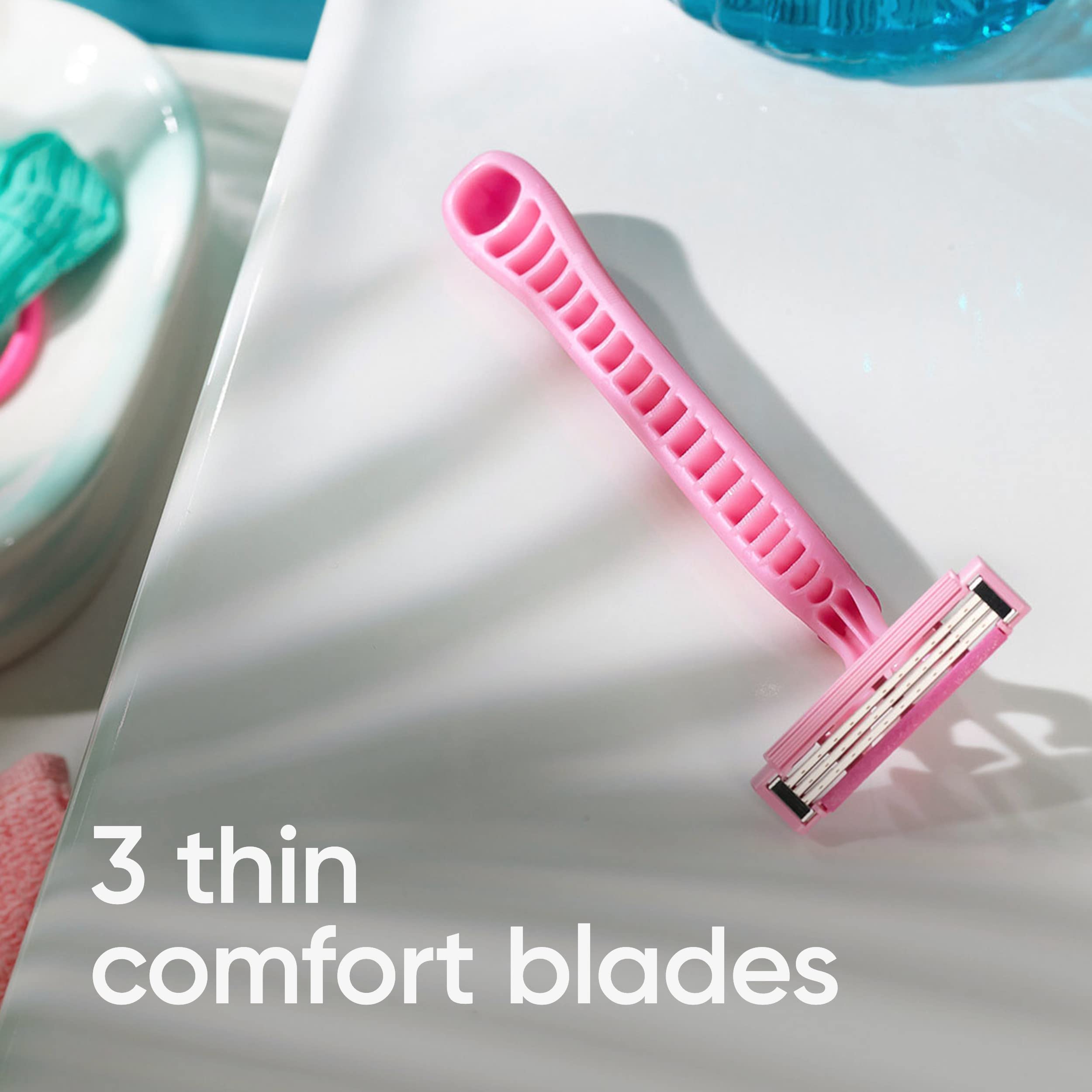 Pink Venus Simply 3 women's disposable razor on white bathroom counter showing three thin comfort blades