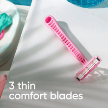 Pink disposable razor with 3 thin comfort blade cartridge