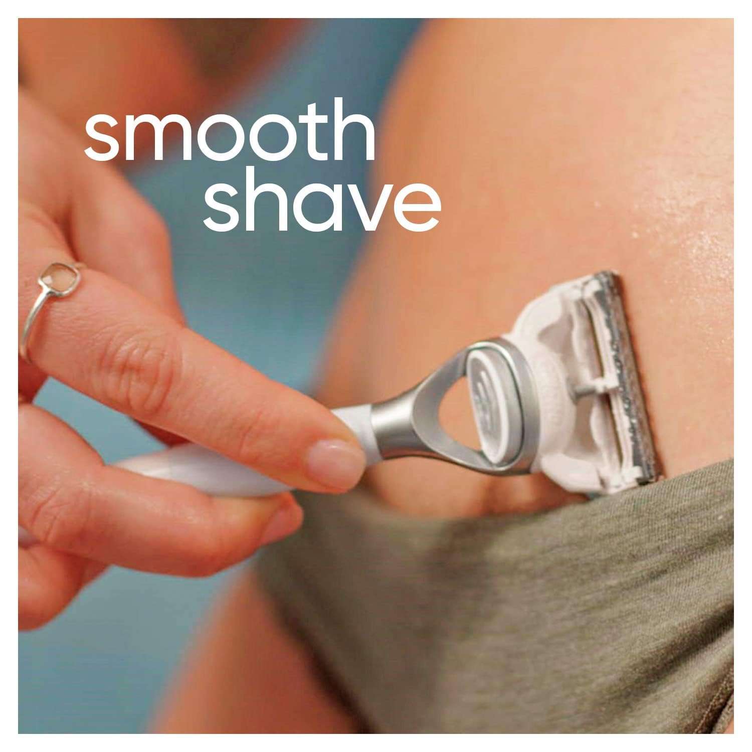 Close up of hand shaving bikini line with Gillette Venus razor for smooth results women's bikini razor blades