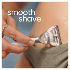 Close up of a woman shaving her bikini line with a Gillette razor for a smooth shave using women's bikini razor blades