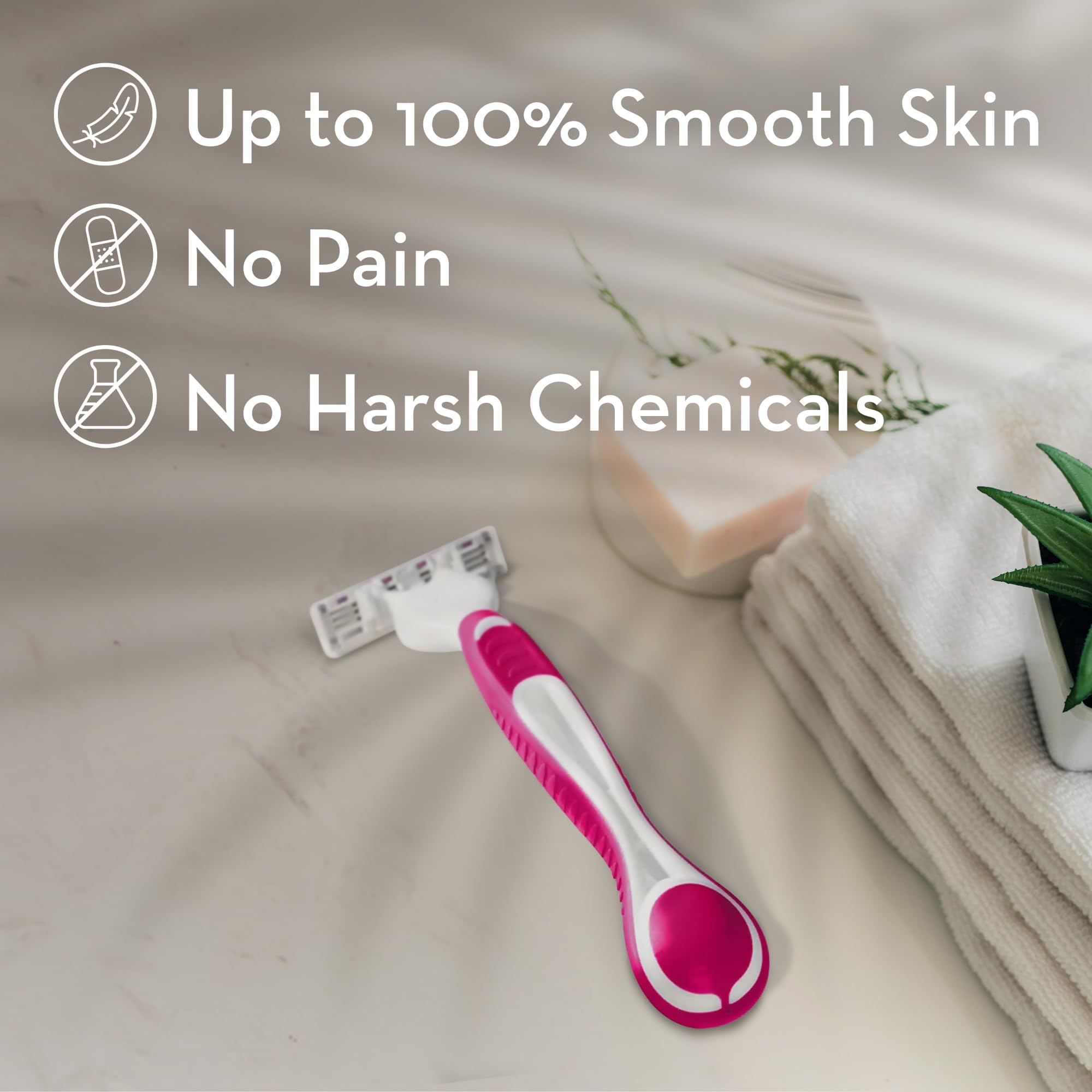Venus pink and white disposable razor on towel beside soap and plant, women's disposable razors for sensitive skin