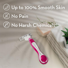 Venus pink and white disposable razor on towel beside soap and plant, women's disposable razors for sensitive skin