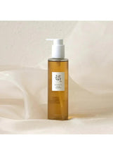 Ginseng Cleansing Oil 210ml pump bottle on light surface with amber glass