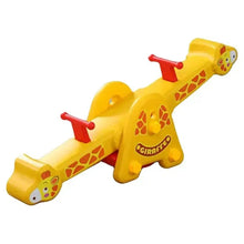 Yellow plastic giraffe rocking toy angled view with red handles and side spots