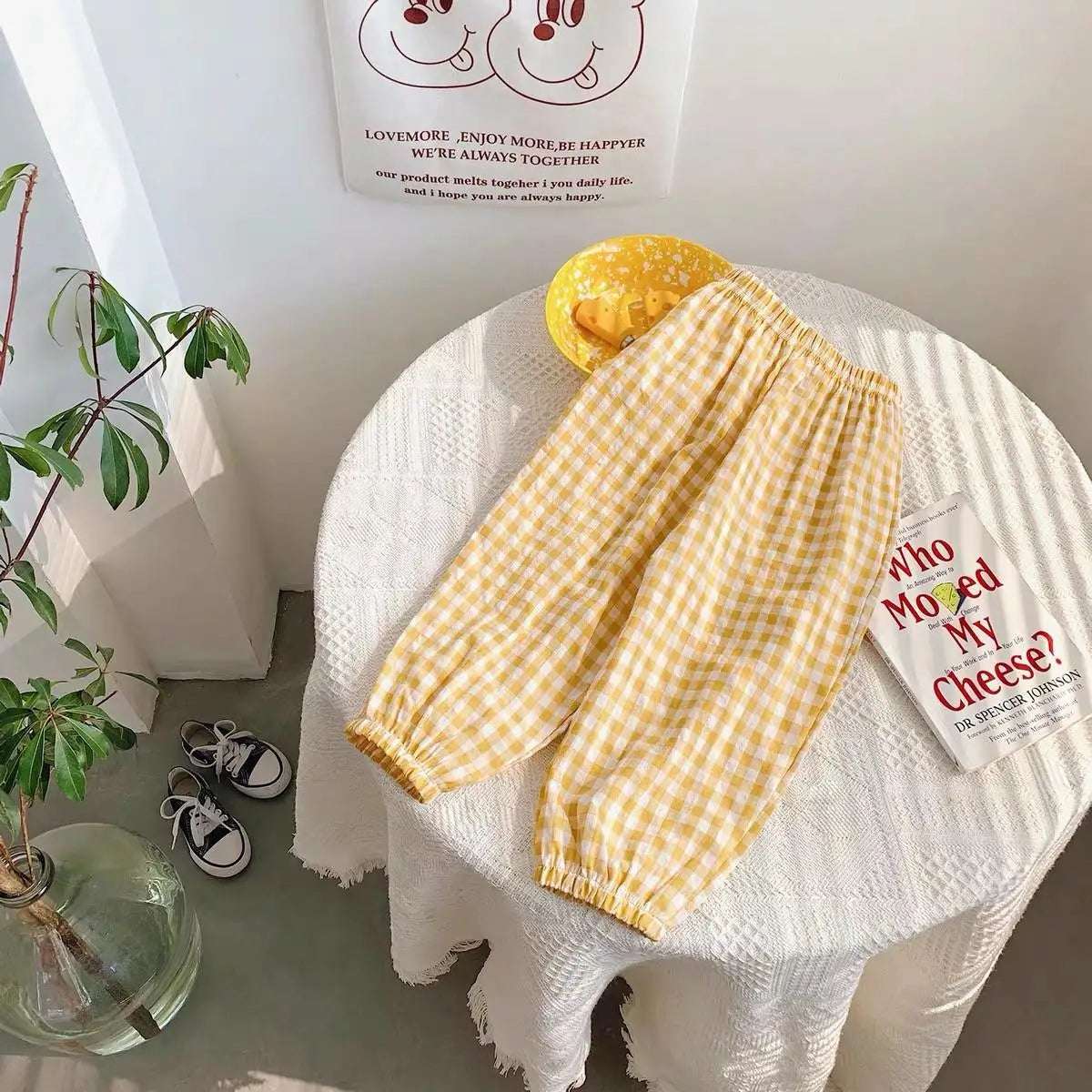 Mumzar girls plaid summer pants in yellow with an elastic waistband displayed on a table