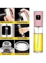 Olive oil spray bottle with stainless cap and clear glass reservoir, anti-leak design