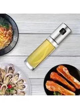 Clear glass olive oil spray bottle with stainless steel cap