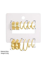 Gold-tone hoop earrings set with mixed hoop and chain-link styles, sizes shown