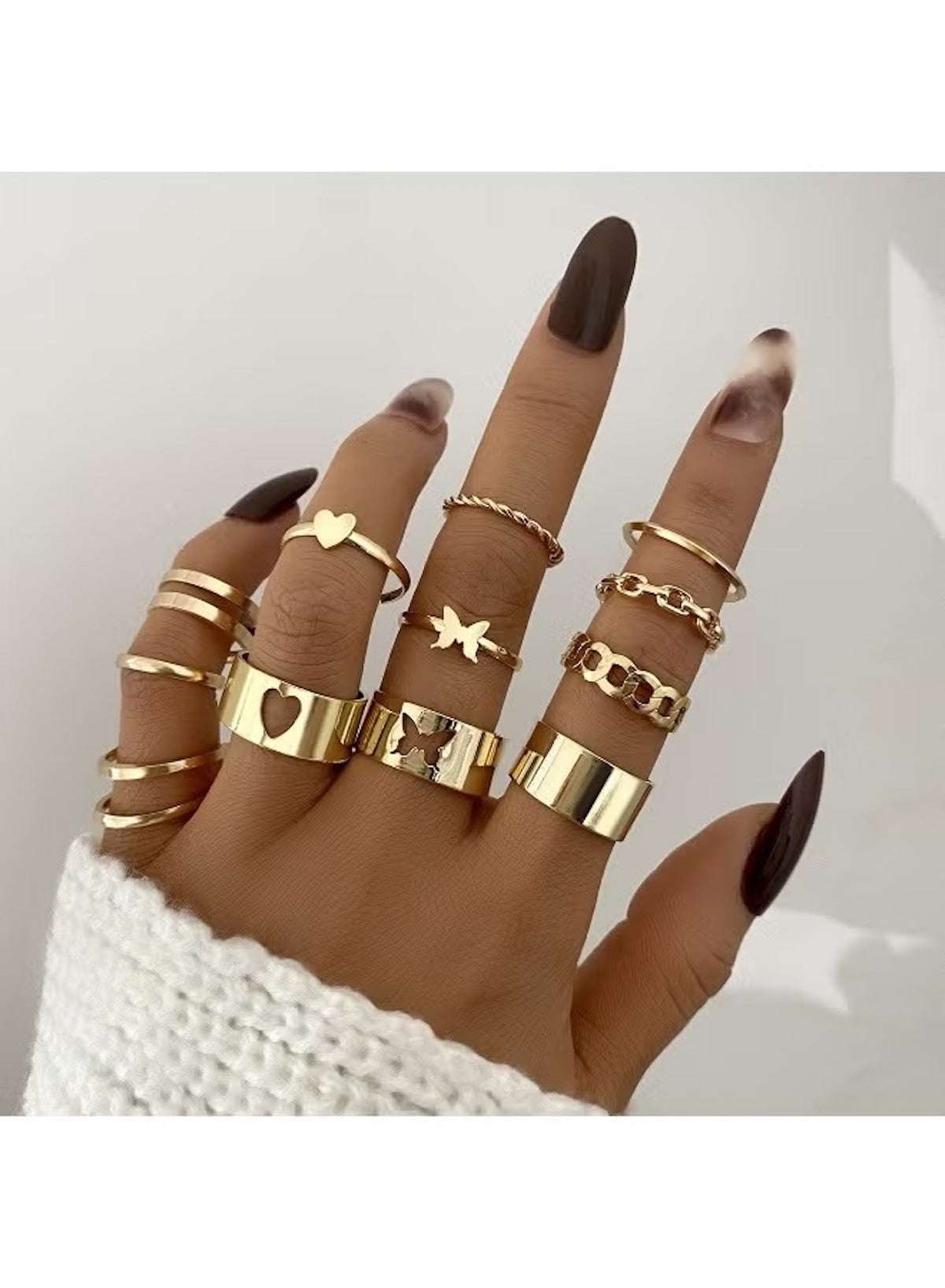 Trendy gold adjustable ring set for women featuring various styles and designs on a hand